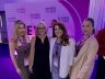 Mayor Eileen Higgins and attendees posing together in front of the Elevate Small Business backdrop