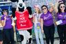 Give Miami Day participants celebrating with the Chick-fil-A cow mascot