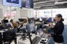 Presenter leading a hands-on digital marketing workshop in a computer lab
