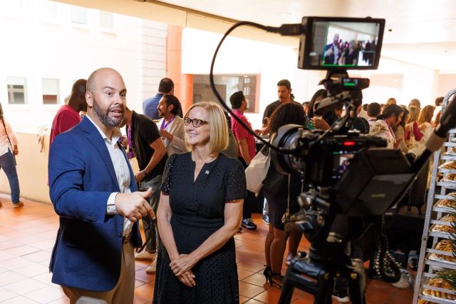 Two Elevate participants speaking together during an on-camera interview