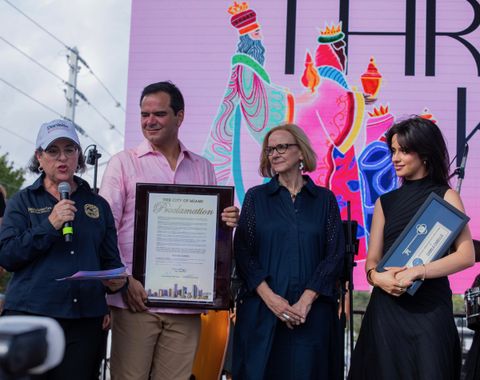 Miami Mayor Daniella Levine Cava, city leaders, and Camila Cabello presenting Three Kings Parade honors onstage